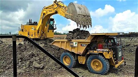 large excavators loading trucks